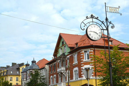 ZELENOGRADSK, RUSSIA - AUGUST 27, 2016: Decorative street hours against the background of the building of the German constructionのeditorial素材
