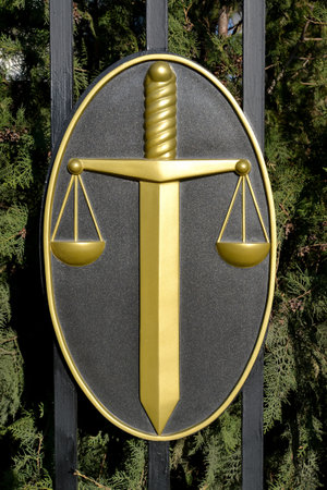 ELISTA, RUSSIA - APRIL 20, 2017: Justice symbols - a sword and scales on a protectionのeditorial素材