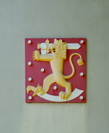 HAMINA, FINLAND - JULY 12, 2014: A lion with a sword on a red backgroundのeditorial素材