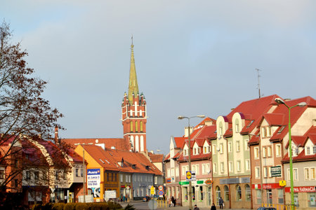KENTShIN, POLAND - JANUARY 02, 2014: View of Vladislav Sikorsky Street and spike of a church of St. Katarzhinaのeditorial素材