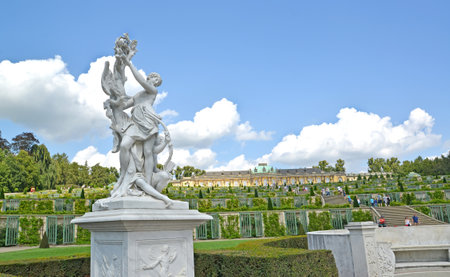 Sculpture against the background of grape terraces and Frederick the Great's palace in the park of Sanssousi. Potsdam, Germanyのeditorial素材