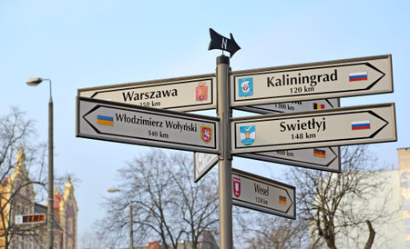 KENTShIN, POLAND - JANUARY 02, 2014: The index of distances and the directions to the cities of Russia, Ukraine, Germany. Polish text "Kaliningrad, Light, Vladimir Volynsky, Warsaw, Vesel"のeditorial素材