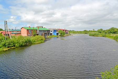 The Deyma River with houses ashore. Polessk, Kaliningrad regionの写真素材