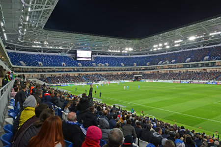 KALININGRAD, RUSSIA - APRIL 11, 2018: A tribune with fans at a football match between the Baltika teams - Krylja Sovetov. Baltic Arena stadiumのeditorial素材