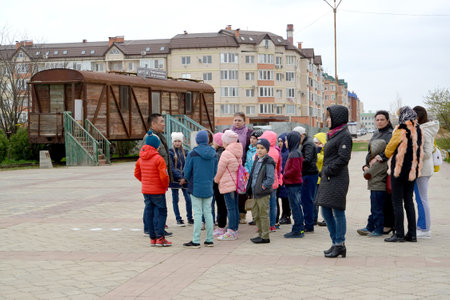 ELISTA, RUSSIA - APRIL 21, 2017: School excursion group in the territory of the memorial complex "Outcome and Return". Car museum of Stalin deportation of Kalmyksのeditorial素材
