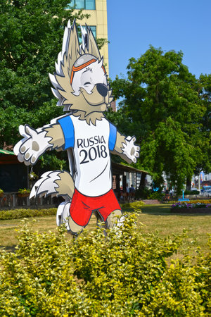 KALININGRAD, RUSSIA - JUNE 21, 2018: A billboard with the image of a mascot of the World Cup FIFA 2018 of a wolf cub of Zabivakiのeditorial素材