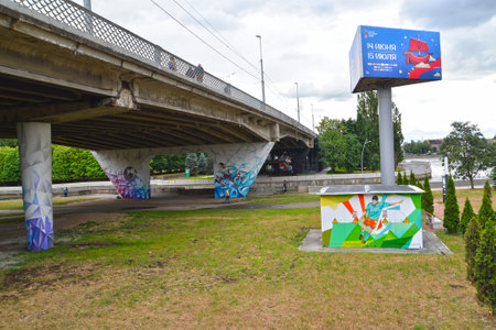 KALININGRAD, RUSSIA - JUNE 22, 2018: Graffiti on a football subject on support of the trestle bridge and the transformer box and an advertizing banner. The 2018 FIFA World Cup in Russiaのeditorial素材