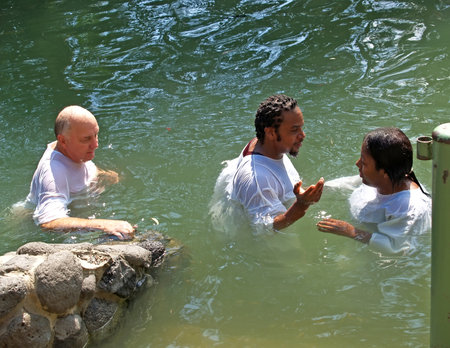 YORDANIT, ISRAEL - OCTOBER 06, 2012: Pilgrims make ablution in holy waters of the Jordan Riverのeditorial素材