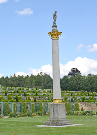 POTSDAM, GERMANY - AUGUST 14, 2017: A column of the Corinthian warrant with a sculpture at top. Park of San Sushiのeditorial素材