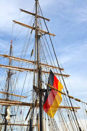 The flag of Germany flutters on a mast of the sailing vesselの写真素材