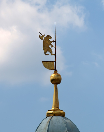 Spire with a bear - the coat of arms of Yaroslavl against the background of the blue skyの写真素材