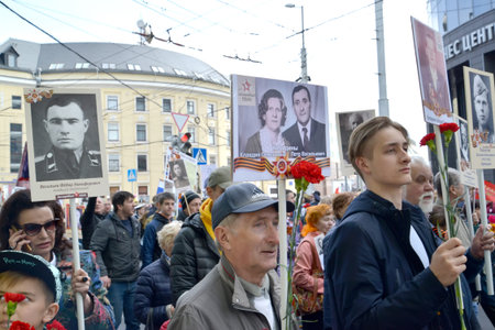 KALININGRAD, RUSSIA - MAY 09, 2019: People are holding portraits of participants in the Great...
