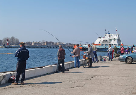 BALTIC, RUSSIA - APRIL 24, 2011: Catching herring in the sea channel. Kaliningrad regionのeditorial素材