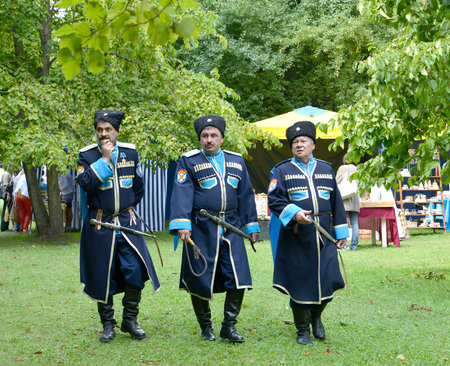 KALININGRAD, RUSSIA - AUGUST 15, 2014: Kazacks of the Baltic Kazakh Union in a park at a folk crafts...