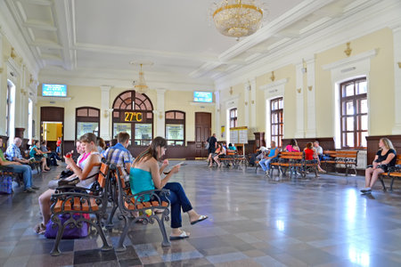 KAZATIN, UKRAINE - JUNE 21, 2013: Passengers in the waiting room of the railway stationのeditorial素材