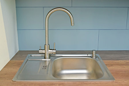 Cut-in metal sink with combined tap for tap and filtered water