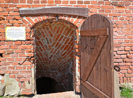KALININGRAD REGION, RUSSIA - MAY 06, 2018: Entrance to the underground museum exposition "Holy Inquisition." Shaaken Castle, XIII centuryのeditorial素材
