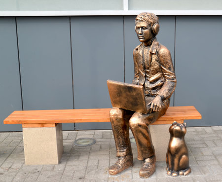 KALININGRAD, RUSSIA - OCTOBER 04, 2020: Sculpture "Young Man with a Laptop and a Cat"のeditorial素材