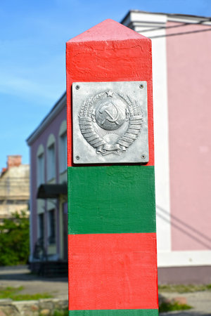 OZERSK, RUSSIA - AUGUST 24, 2019: Coat of arms of the Soviet Union on the border post. Fragment of...