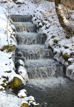 Waterfall on the Vozdushny stream on a winter day. Kaliningradの写真素材