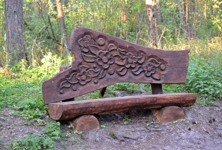 KALININGRAD REGION, RUSSIA - APRIL 26, 2014: Wooden decorative carved bench on the territory of the Visitor Center "Museum Complex of the Curonian Spit National Park".のeditorial素材