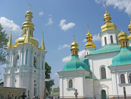 Bell tower in the Far Caves and a fragment of the Cathedral of the Nativity of the Blessed Virgin...