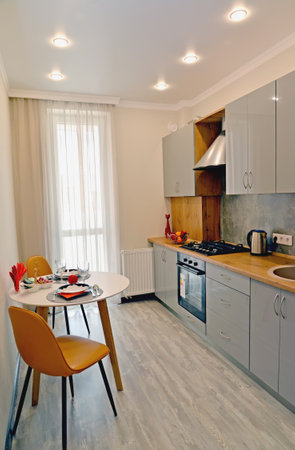 KALININGRAD, RUSSIA - AUGUST 11, 2021: Dining table for two in the interior of a modern kitchenのeditorial素材