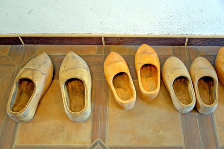 KALININGRAD REGION, RUSSIA - JULY 19, 2020: Old wooden shoes stand on the floor. Museum Old German...