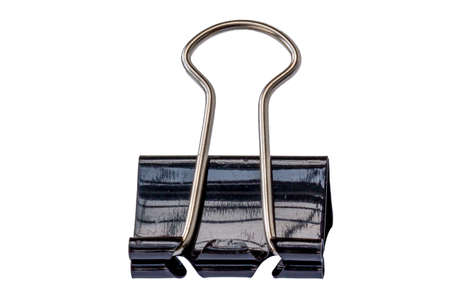 One black paper clip made of metal, isolated with a white background, for office, work, school and business conceptsの写真素材