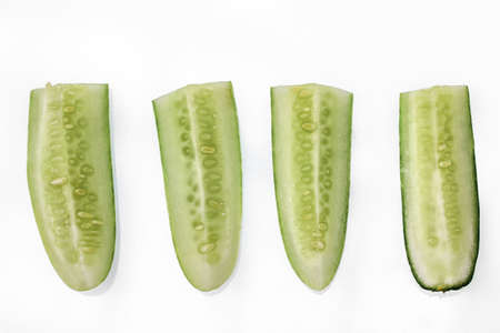 Four pieces of cucumber for fresh vegetables, usually consumed for fresh vegetables, isolated on a white background, copy spaceの写真素材
