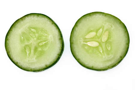 Two slices of cucumber for fresh vegetables, isolated on white background, copy spaceの写真素材