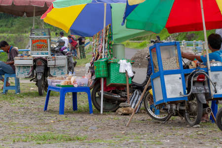Some traveling vendors seem to be empty of buyers during the coronavirus pandemic. YOGYAKARTA, INDONESIA - OCTOBER 28, 2021.のeditorial素材