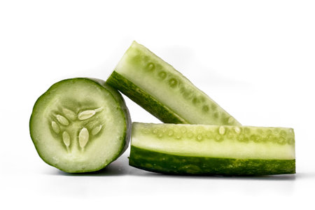 Cucumber for fresh vegetables in sliced form, isolated on white background, copy spaceの写真素材