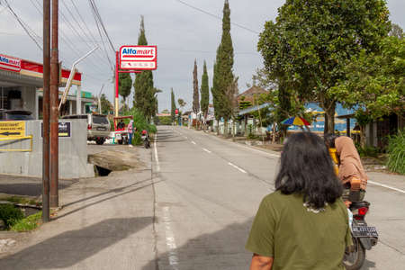 Retail networks have entered remote areas, serving local residents as well as threatening local grocery traders. BOYOLALI CENTRAL JAVA, INDONESIA - NOVEMBER 7, 2021.のeditorial素材