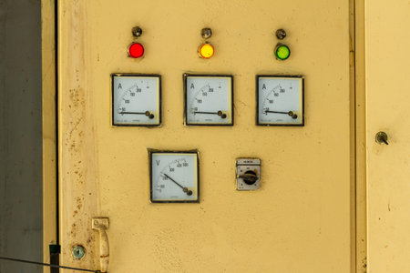 The fuse box in an office building, placed in the corner of an area that is not disturbed by...