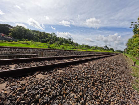 The view of the rail road in Yogyakarta Indonesia, visible rocks and a clear sky backgroundの写真素材