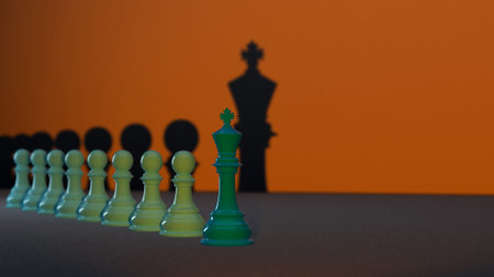 Several green Chess Pawns lined up with the Chess King at the forefront, the concept of leadership...
