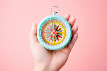 Hand holding a compass, Concept of Strategic orientation in business or marketing. Purpose and direction in business.の素材
