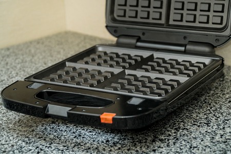 Opened Electronic Waffle maker. Sample model for Kitchen applianceの写真素材