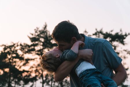 Father with young son having fun in the parkの写真素材