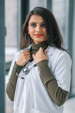 Young Indian medical student at the clinic in practiceの写真素材