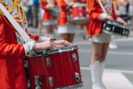 Young girls drummer at the parade. Street performance. Majorettes in the paradeの写真素材