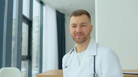 Portrait of a private practice male doctor in his medical officeの写真素材