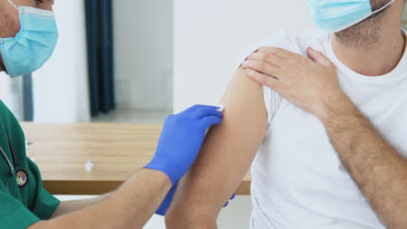 Doctor making  vaccine to patientの写真素材