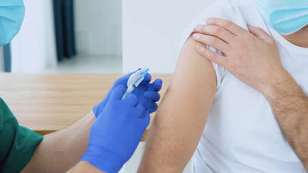 Doctor making  vaccine to patientの写真素材