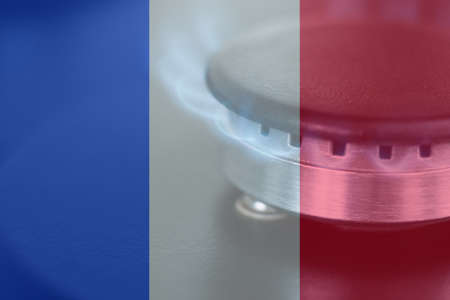 Gas burns against the background of the France flag. Gas deficit, gas embargoの写真素材