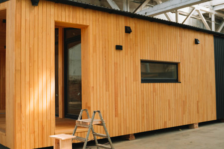 Newly built single storey prefabricated modular building. Prefabricated mobile wooden house at construction siteの写真素材