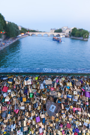Many Love locks on a bridge in Paris , symbol of eternal love and relationship, with romantic Seine river as background, Paris, Franceの写真素材