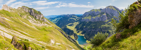 Panorama view of Seealpsee (lake) and Alpstein massif in Switzerlandの写真素材