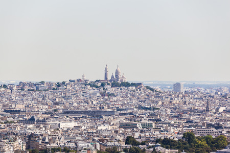 View of Cityscape of Paris in direction of Basilica of the Sacred Heart on the summit of the butte Montmartre from Eiffel tower Paris Franceの写真素材